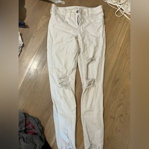 barley worn white ripped jeans